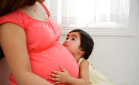 feature-pregnant-woman-with-child-274x168